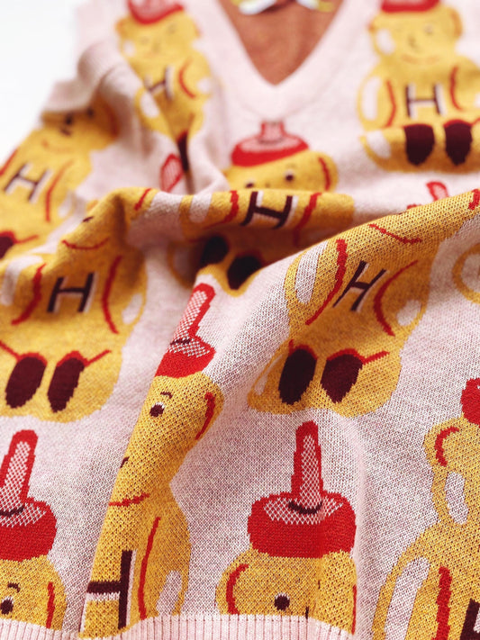 Close-up of a sweater with cartoon honey bear character pattern