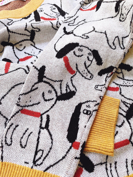 Close-up of fabric with dachshund dog pattern and yellow trim