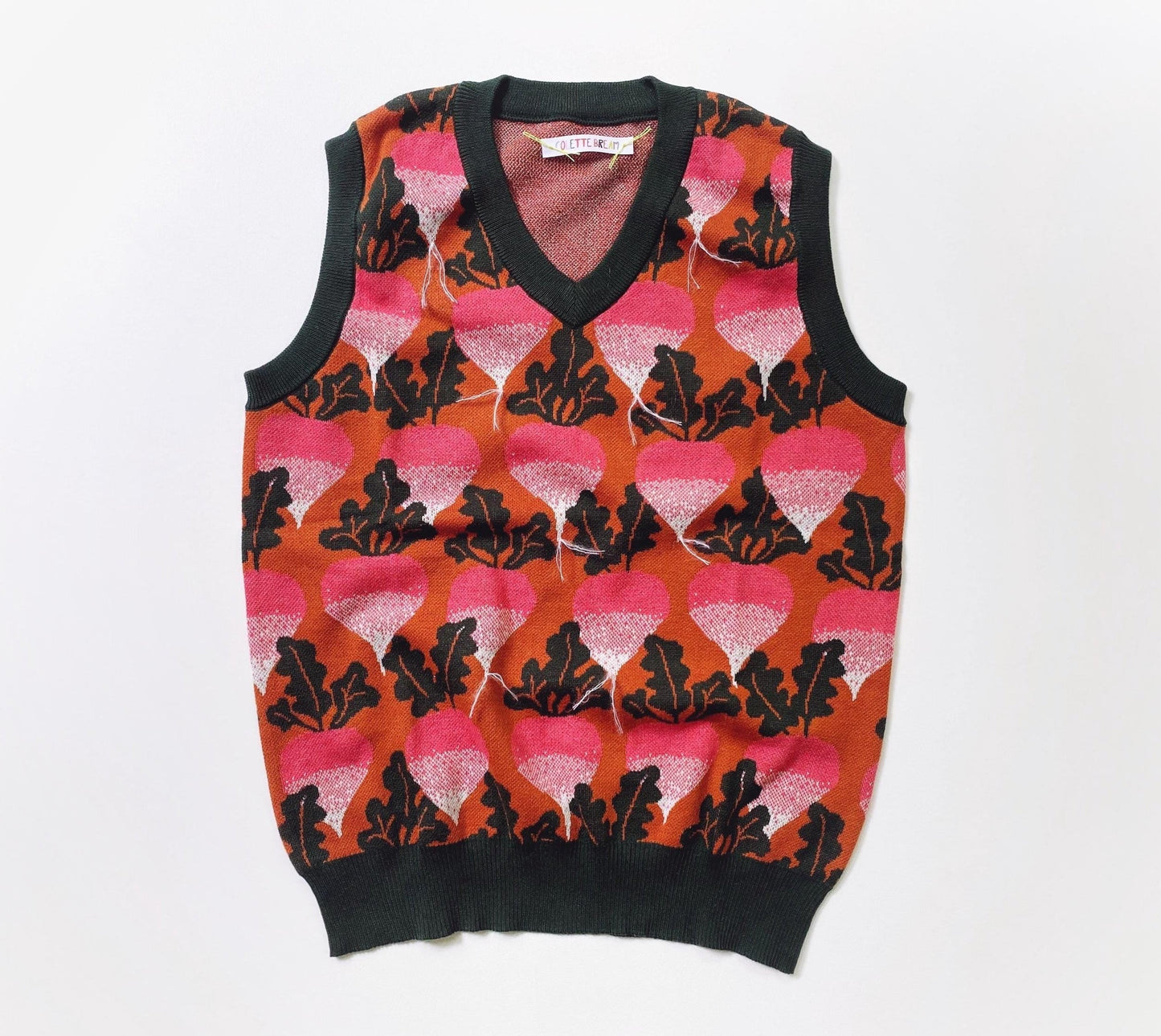 Sweater vest with beets radishes pattern on a white background