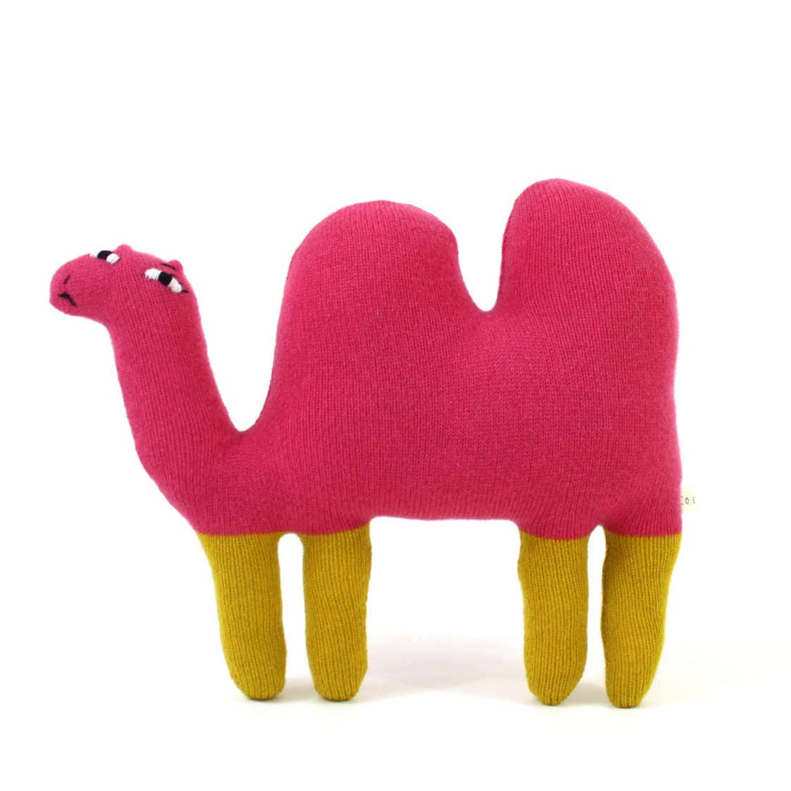 Pink knitted lambswool camel-shaped plush toy on a white background