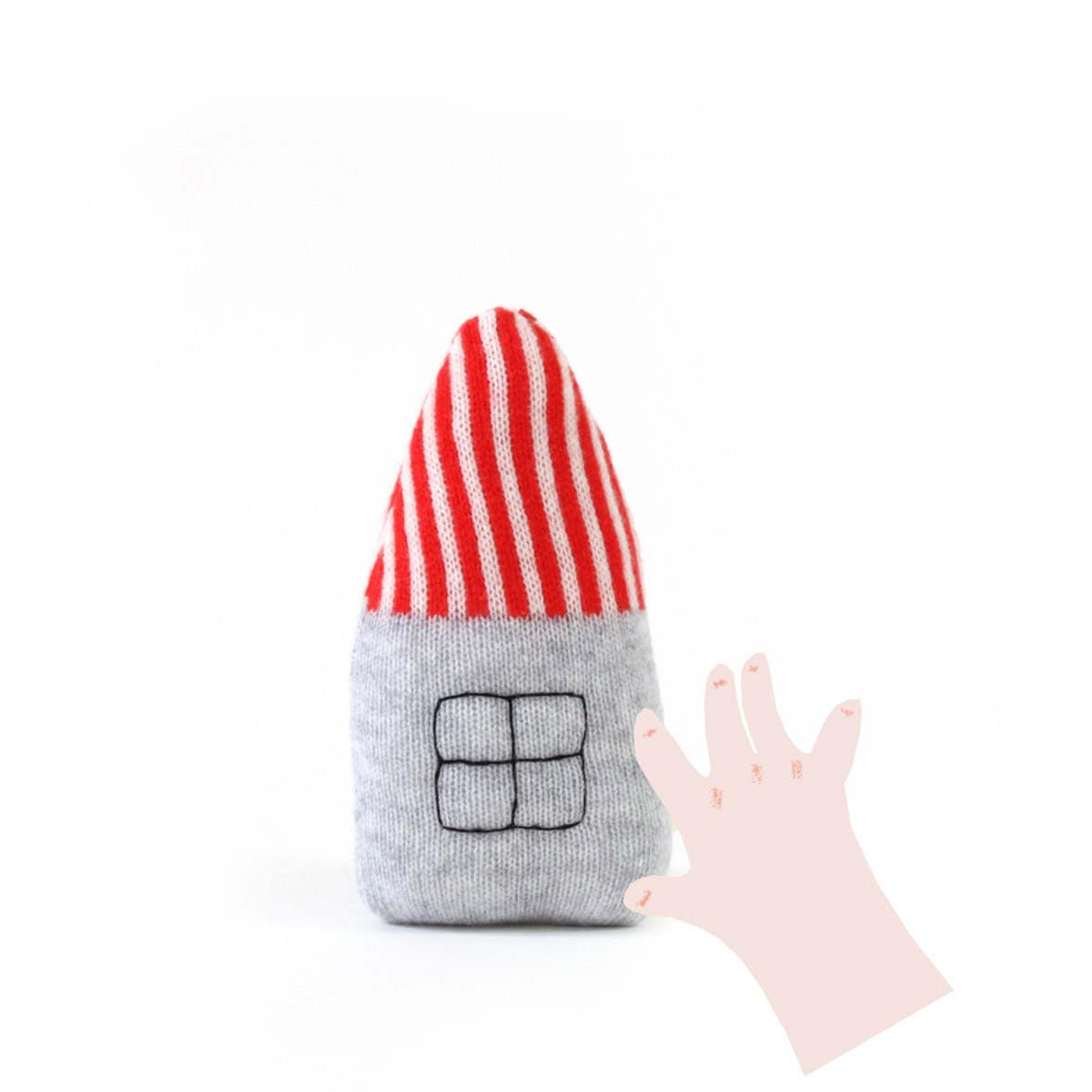 Toy resembling a house with a red and white striped roof and gray body on a white background