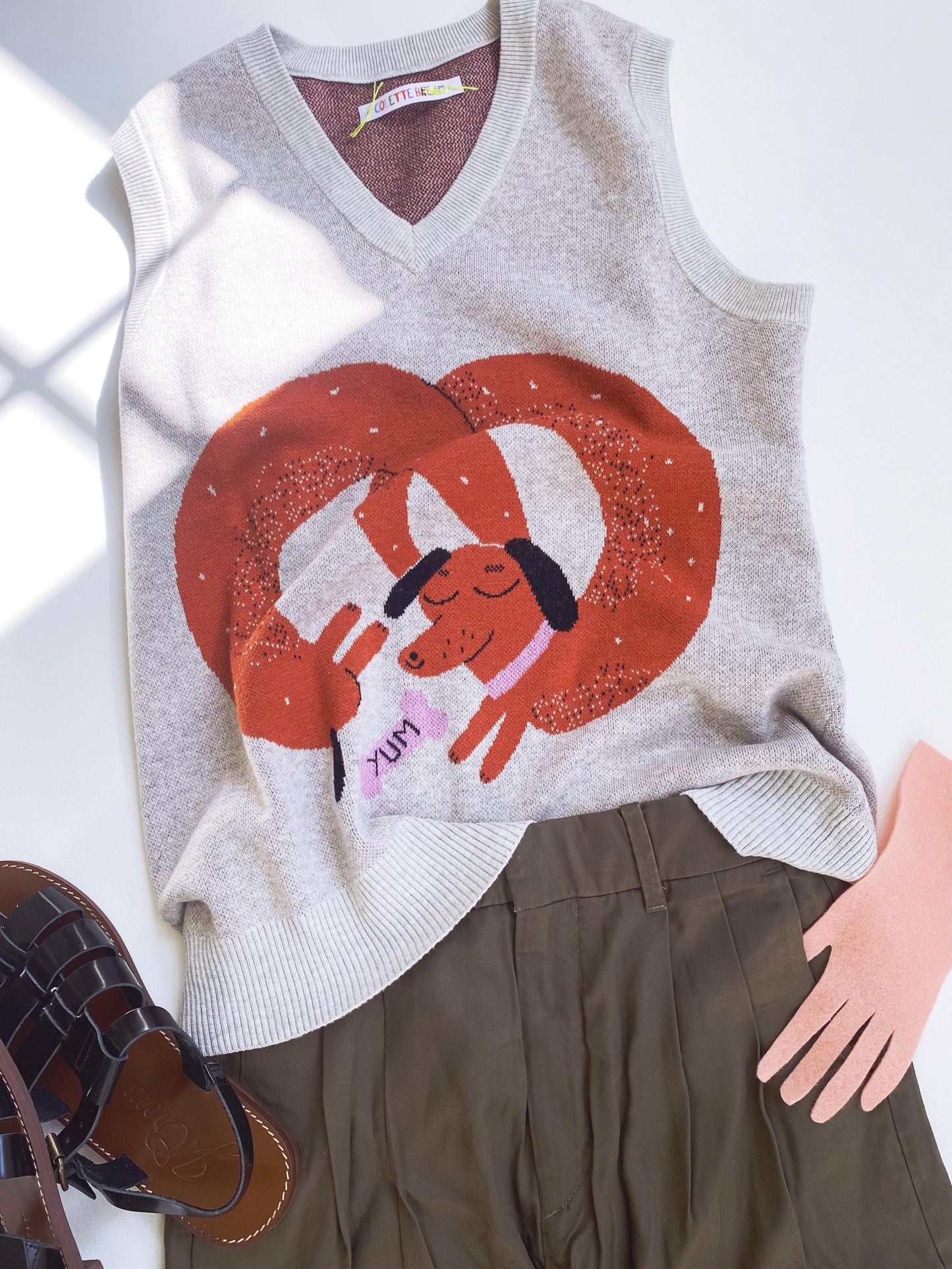 Gray sweater with brown dachshund design on a white background