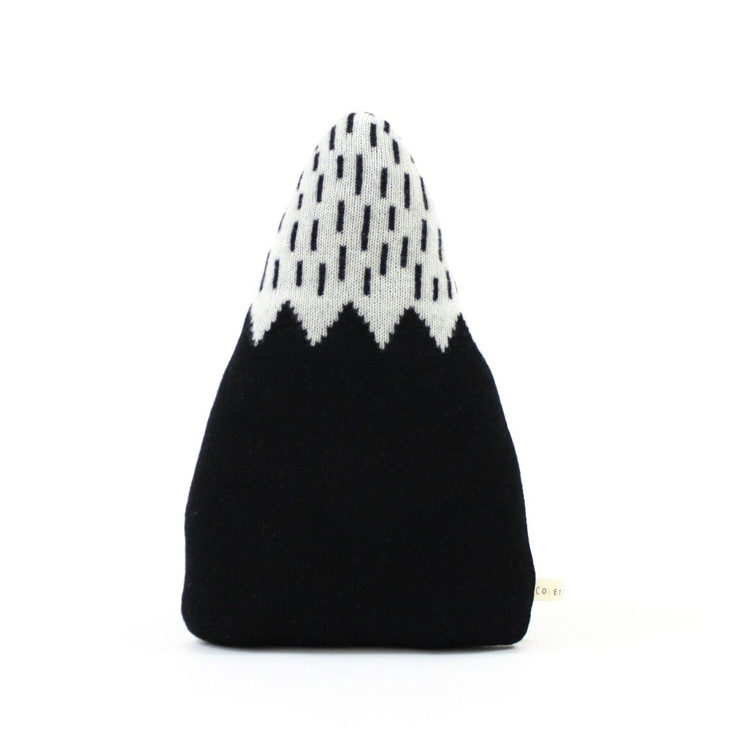 Black and white patterned mountain shaped pillow on a white background