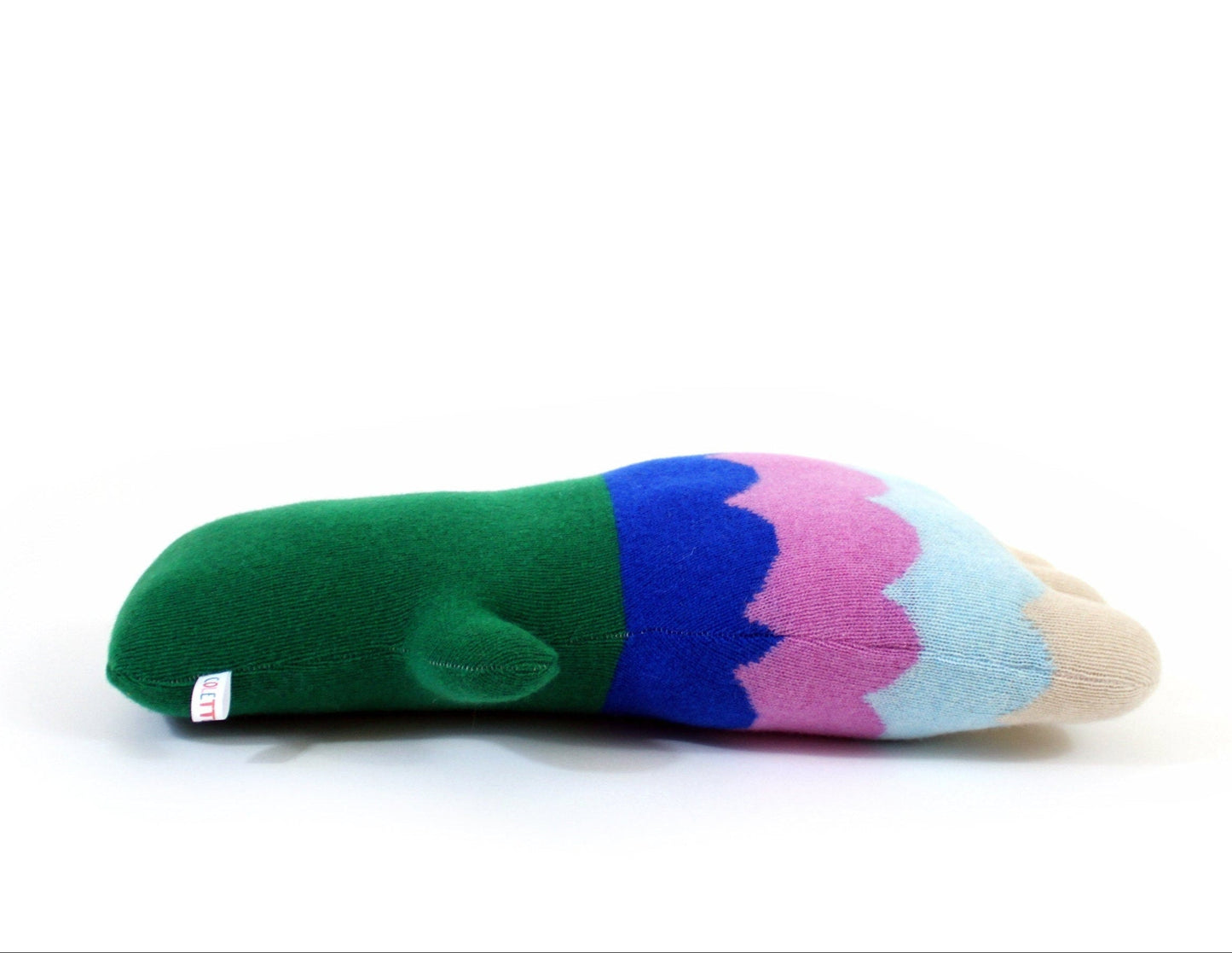 Colorful flower shaped pillow with a gradient pattern on a white background