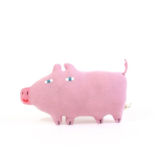 Pink knitted lambswool pig plush toy on a white background