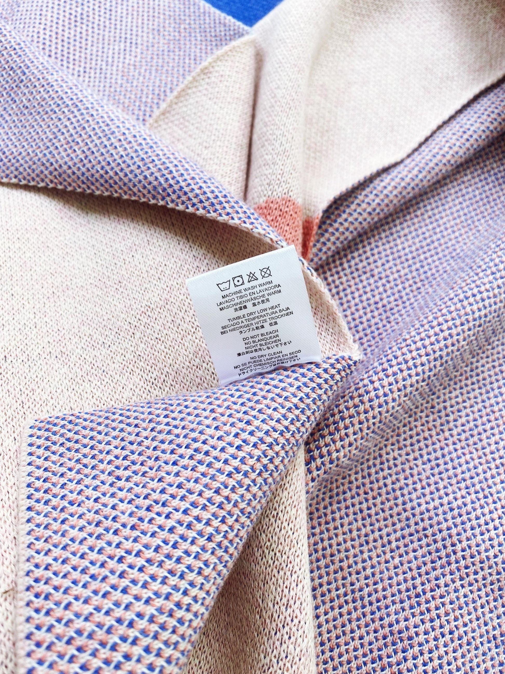 Close-up of a knit fabric texture with a label.