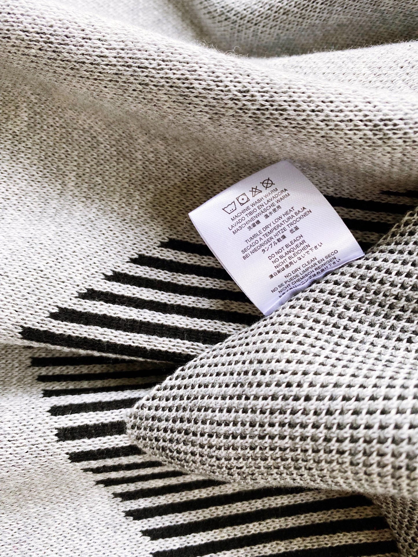 Textile with a label on a textured knit fabric background