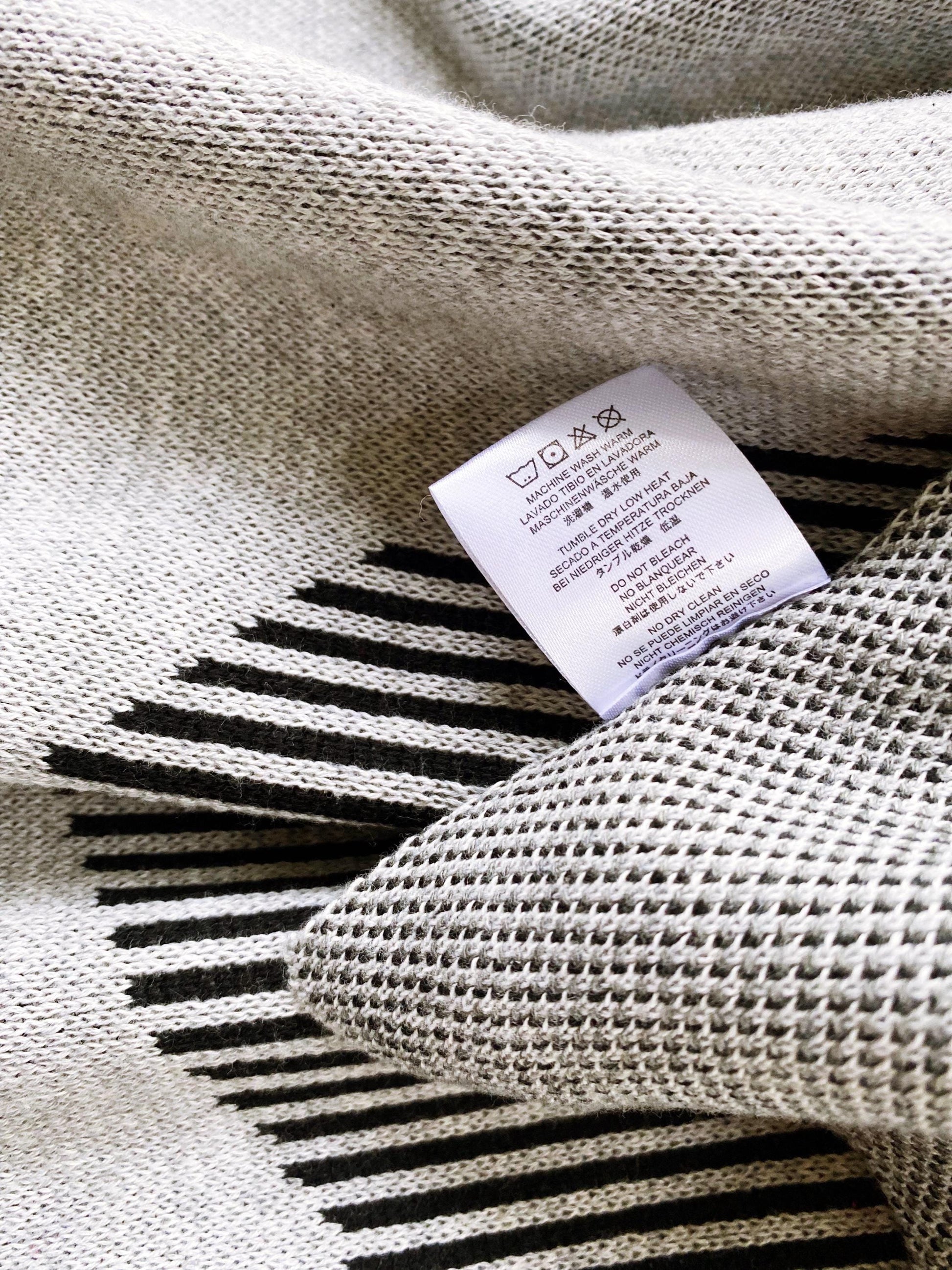 Textile with a label on a textured knit fabric background