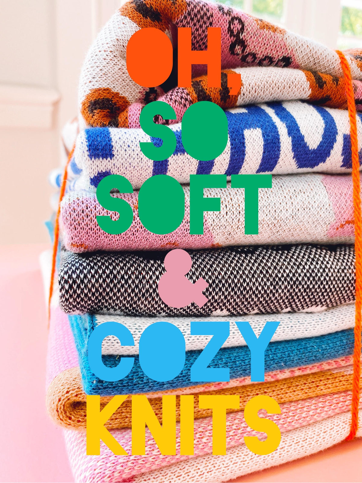Stack of colorful knitted fabrics with 'OH SO SOFT & COZY KNITS' text on a pink background
