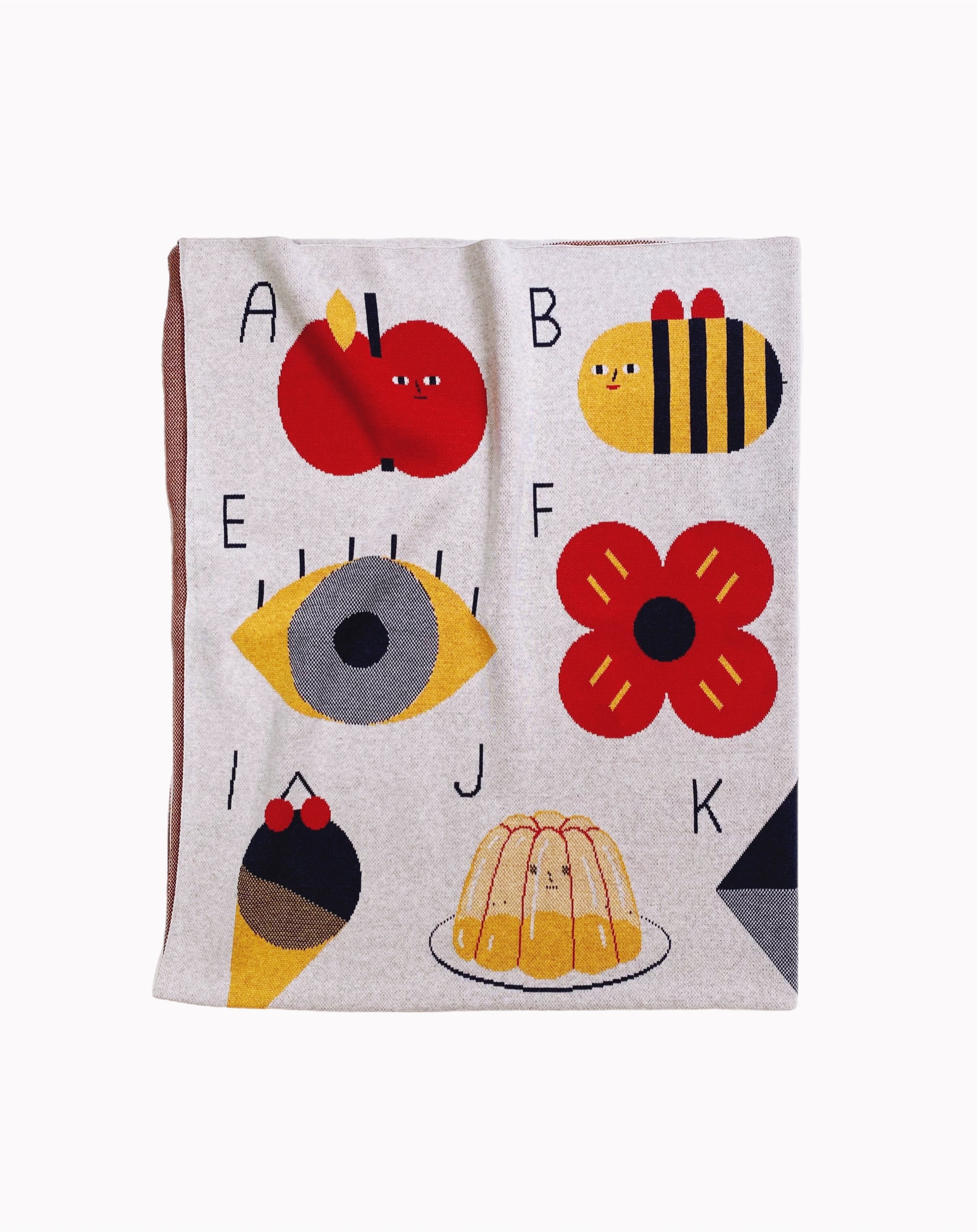Children's knitted alphabet blanket with colorful letters and illustrations on a white background