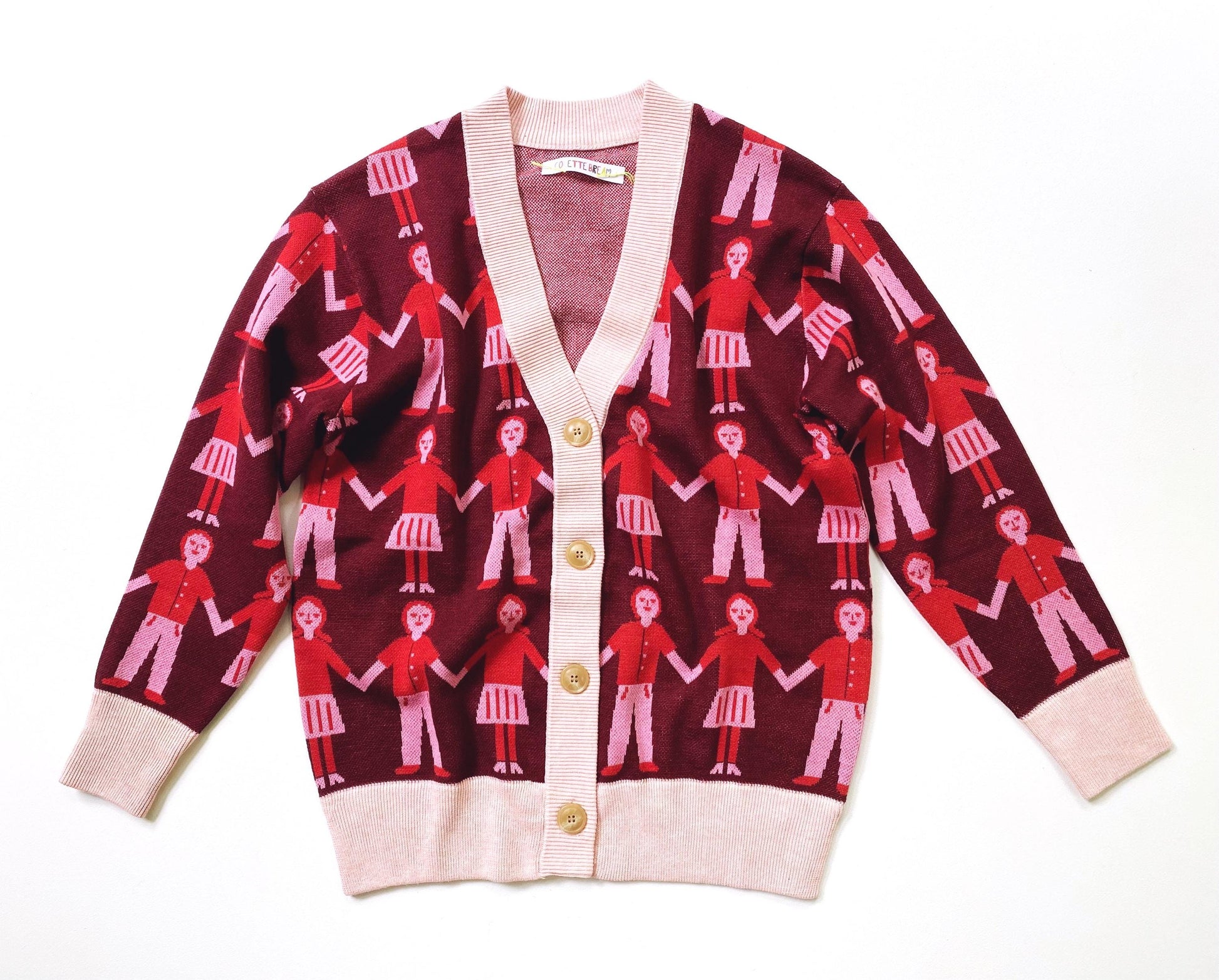 Knitted sweater cardigan with a red and white pattern of people holding hands on a white background