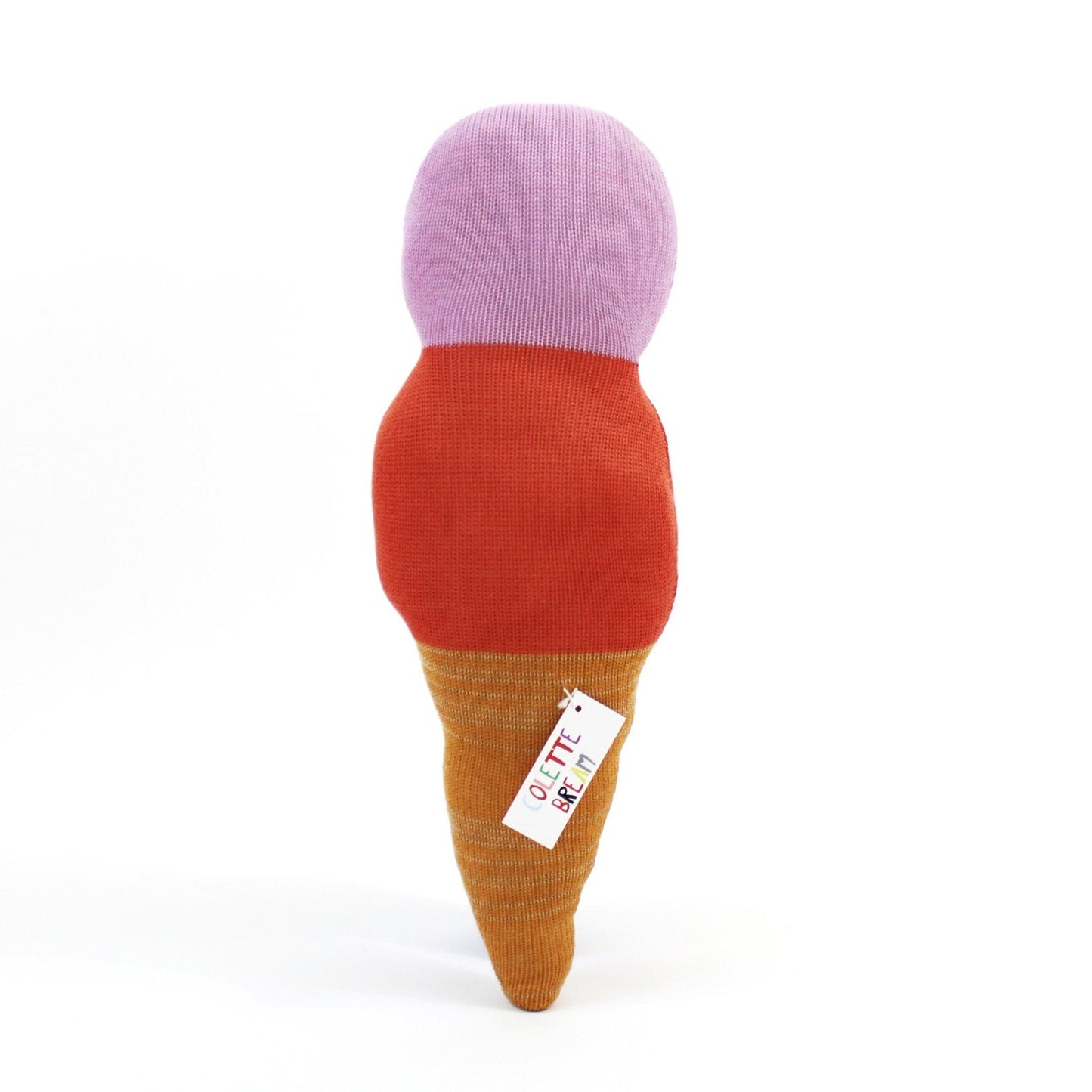 Toy resembling an ice cream cone with a purple top, red middle, and brown base on a white background.