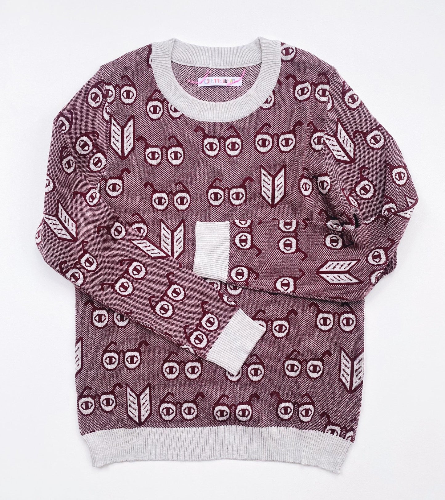 Knitted sweater with a spectacles eyeglasses pattern on a white background