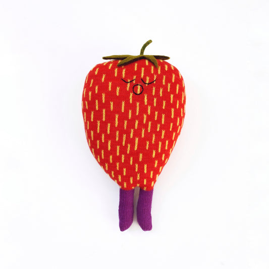 Plush toy shaped like a strawberry with a face on a white background