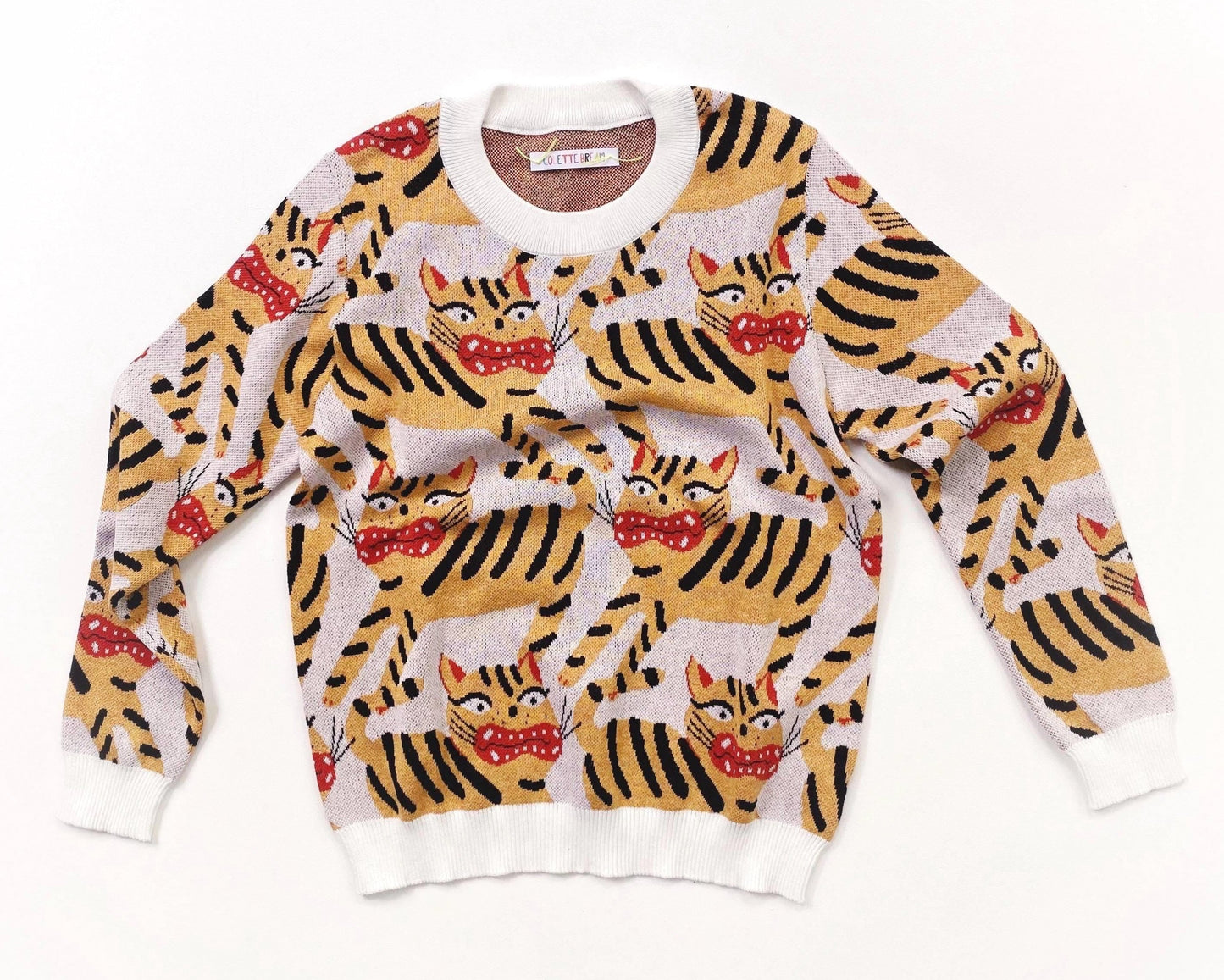 Knitted sweater with Hariko Tora tiger pattern on a white background