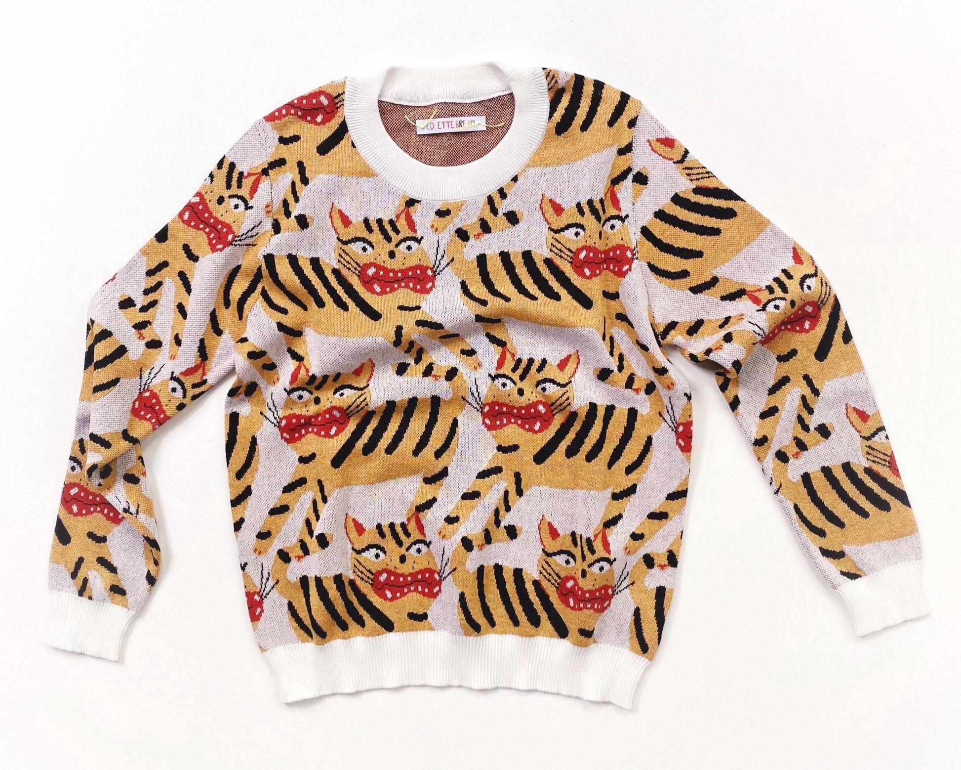Knitted sweater with Hariko Tora tiger pattern on a white background