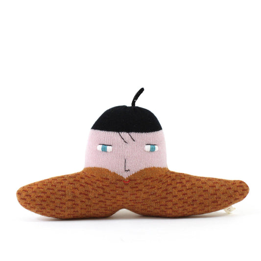 Knitted toy resembling a face with a black hat and brown mustache beard on a white background