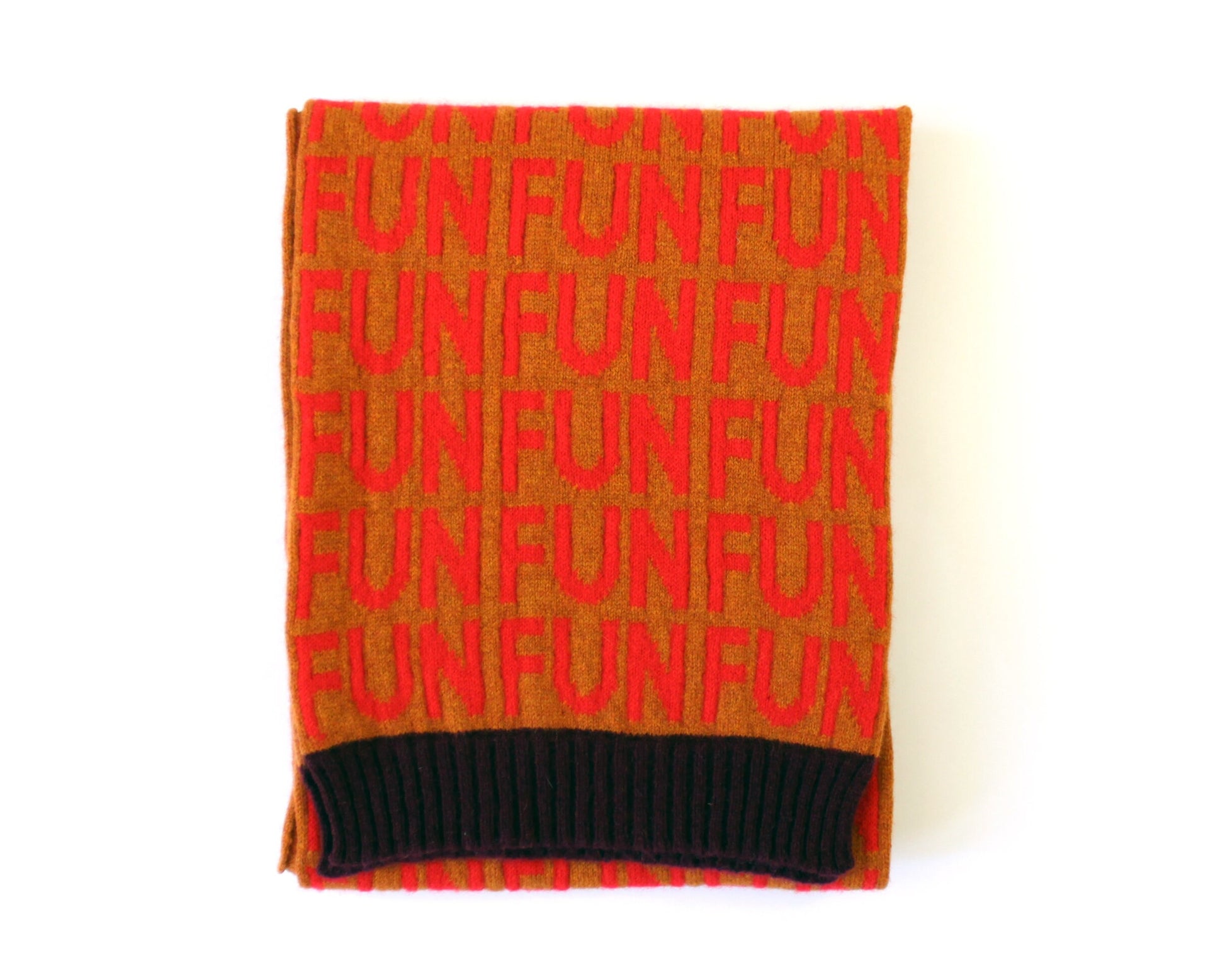 Knitted scarf with 'FUN' pattern in red on a white background