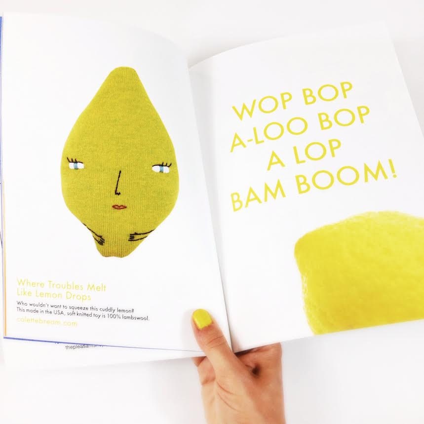 Yellow plush toy resembling a lemon with text on a magazine page.