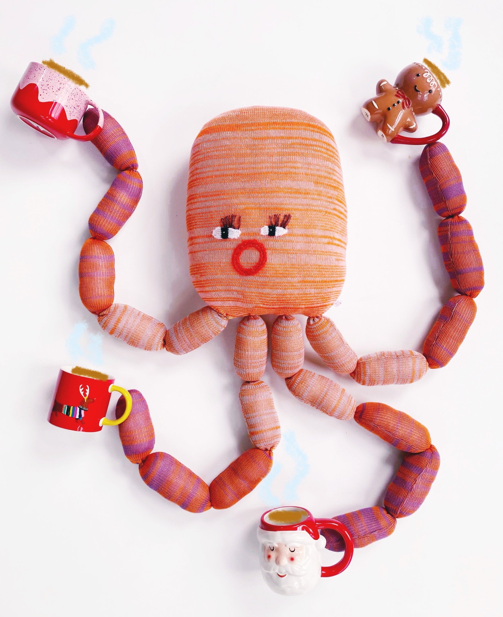 Octopus shaped knitted toy character with cups around it on a white background
