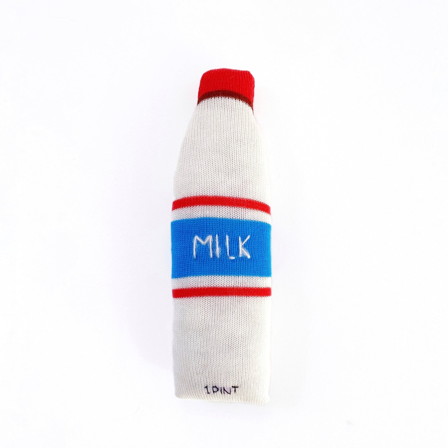 Toy resembling a milk bottle with a blue label on a white background