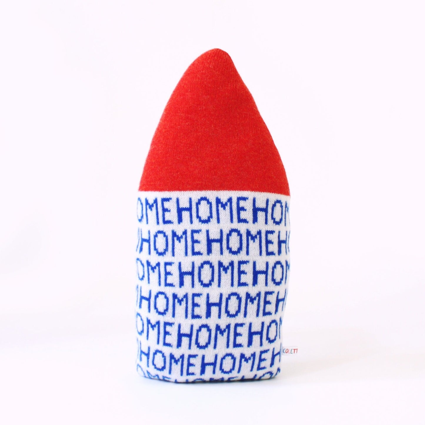 Red and blue plush toy house shaped pillow with 'HOME' text on a white background