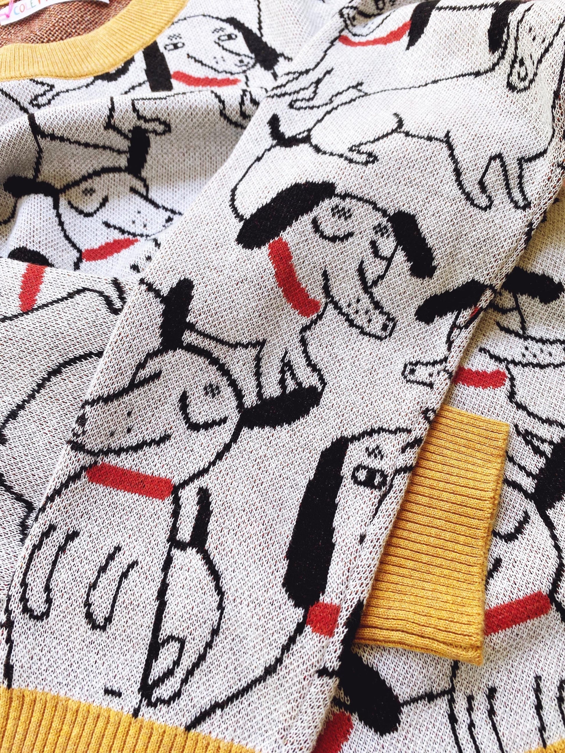 Close-up of fabric with dachshund dog pattern and yellow trim