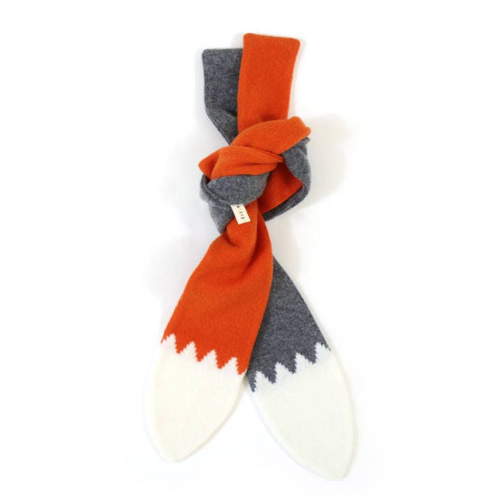 Two colorful knitted lambswool scarves knotted together, one shaped like a wolf tail, the other shaped like fox tail, on a white background