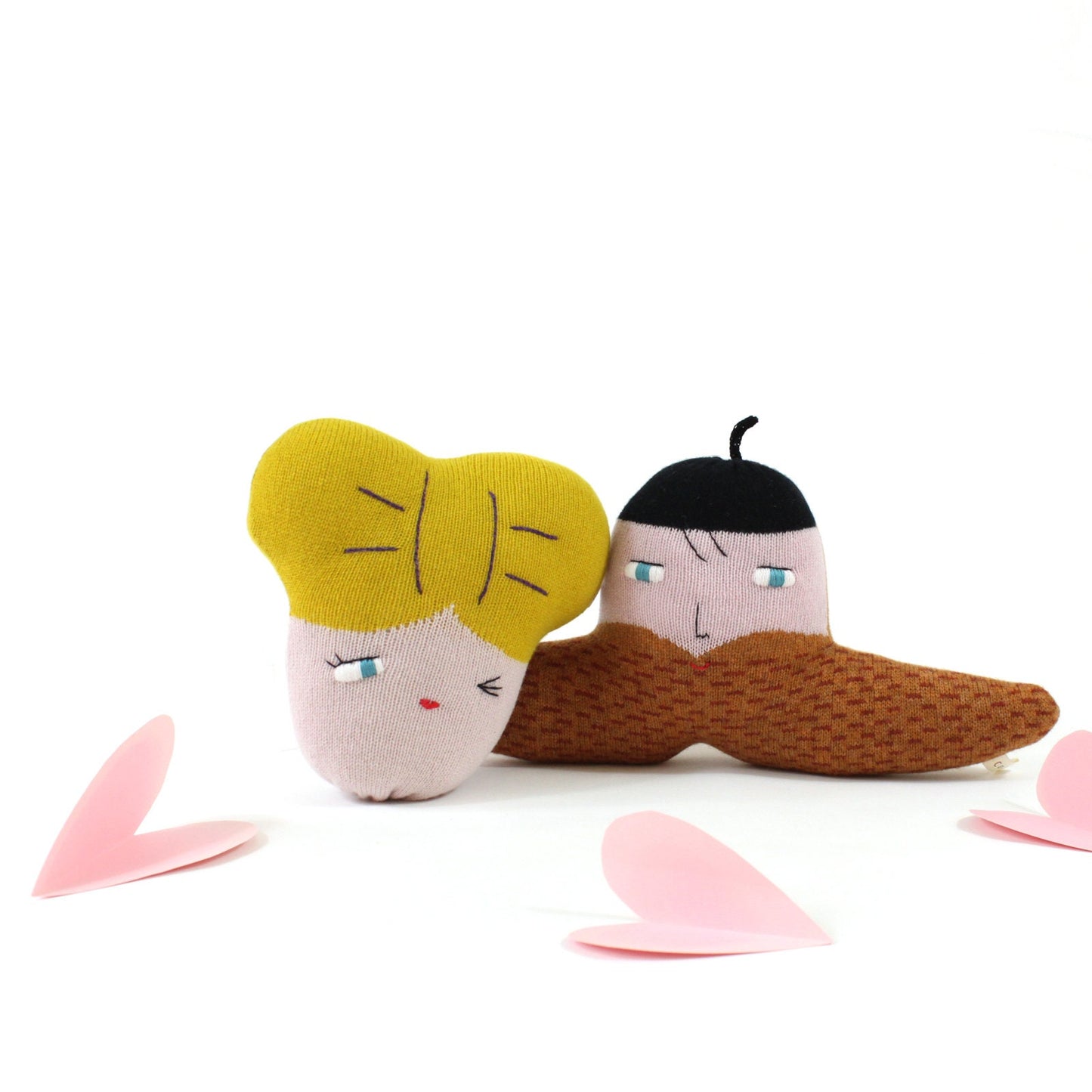 Knitted characters with yellow hair and brown beard on a white background