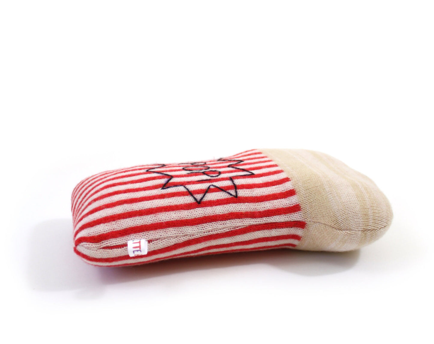 Red and white striped popcorn plush on a white background