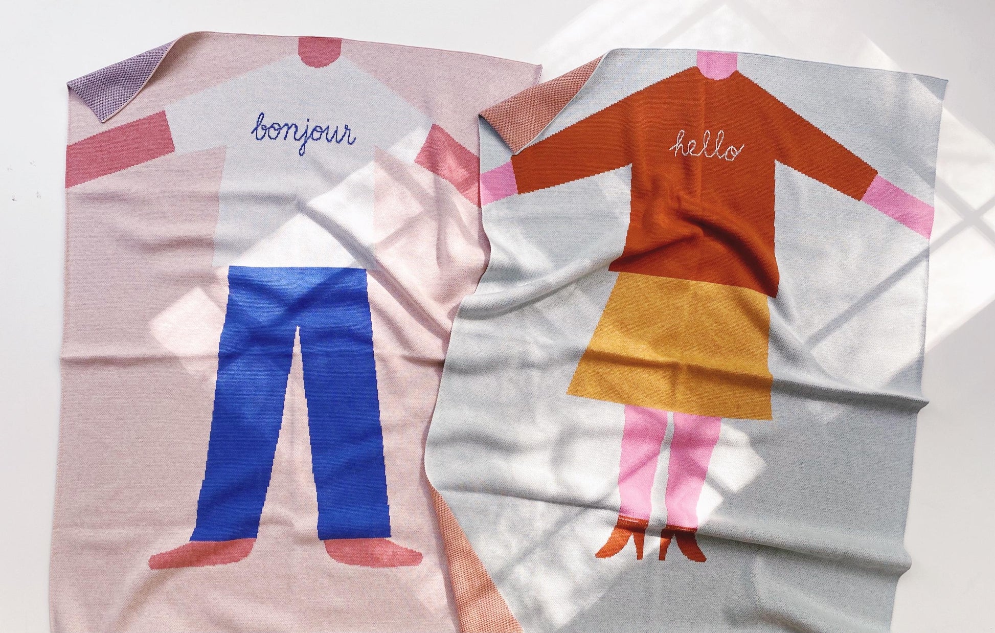 Children's characters with 'bonjour' and 'hello' text on a white background