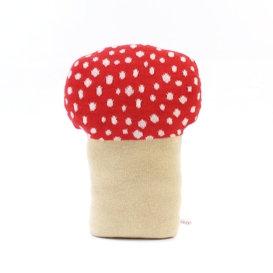 Mushroom-shaped toadstool pillow cushion with red cap and beige stem on a white background